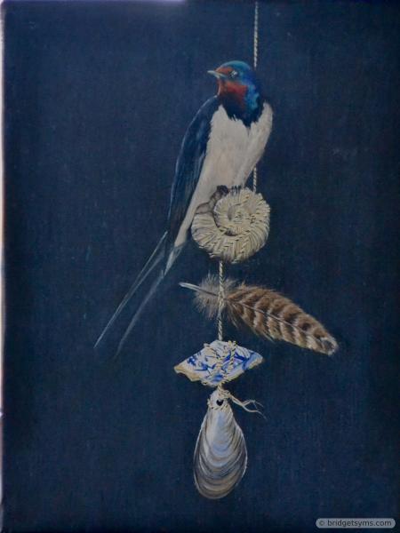 Swallow perched on found objects